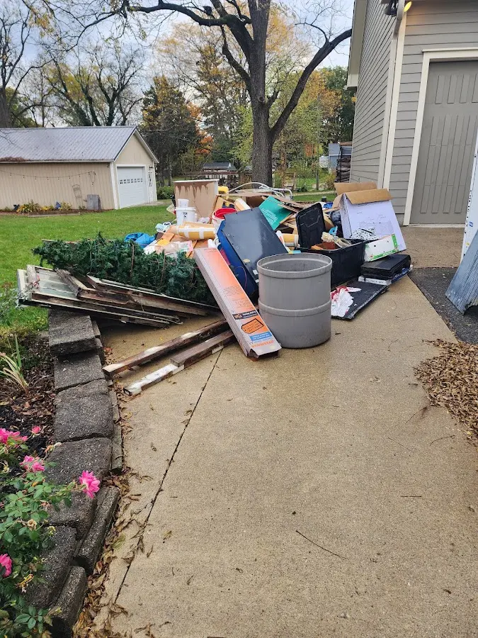 Dumpster being loaded with debris for 30 Yard Dumpster Rental in Ridge Wood Heights